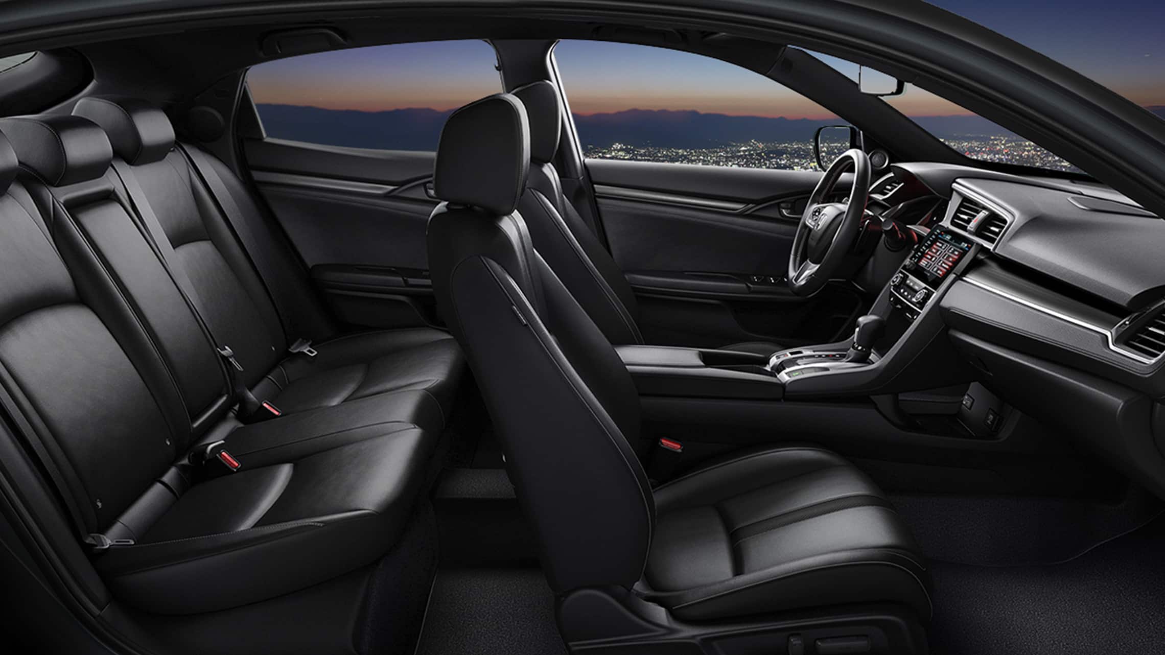 Passenger-side interior profile view of the 2021 Honda Civic Sport Touring Hatchback with Black Leather.