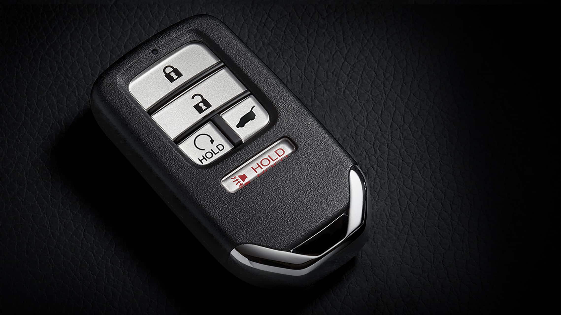 Key fob with remote engine start button detail for the 2021 Honda Civic Sport Touring Hatchback.