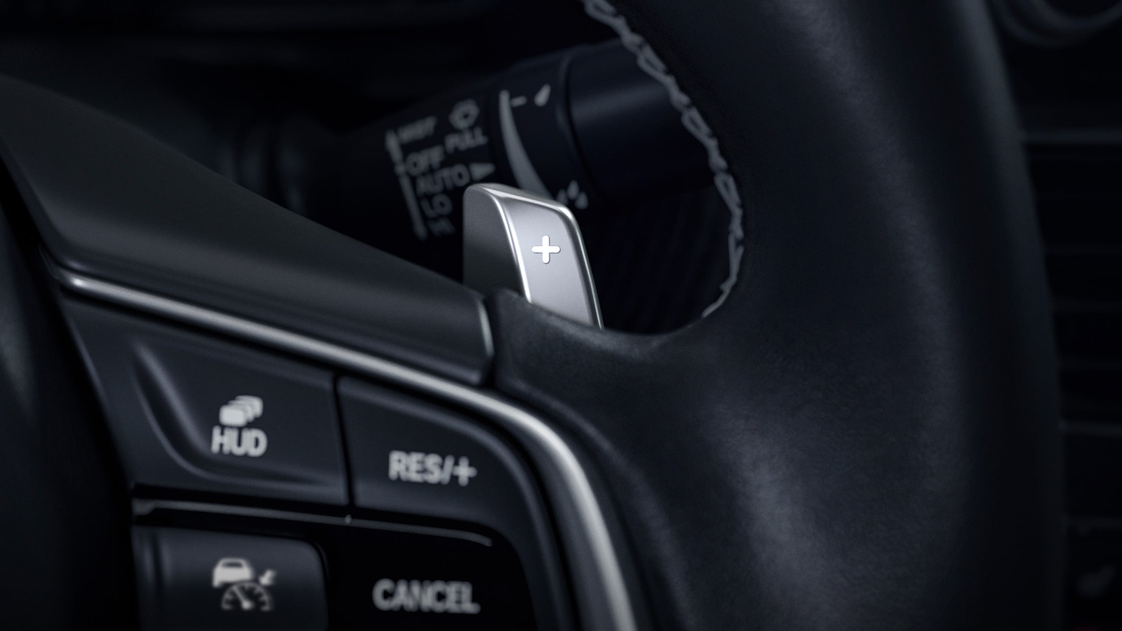 Steering wheel-mounted paddle shifter detail in the 2021 Honda Accord Touring 2.0T.